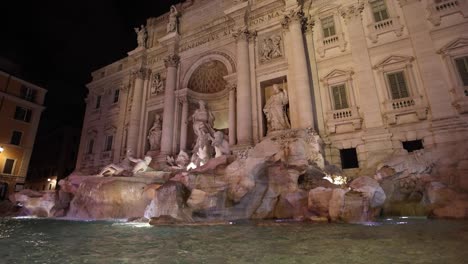 trevi fountain in rome italy tilt up in slow motion at night