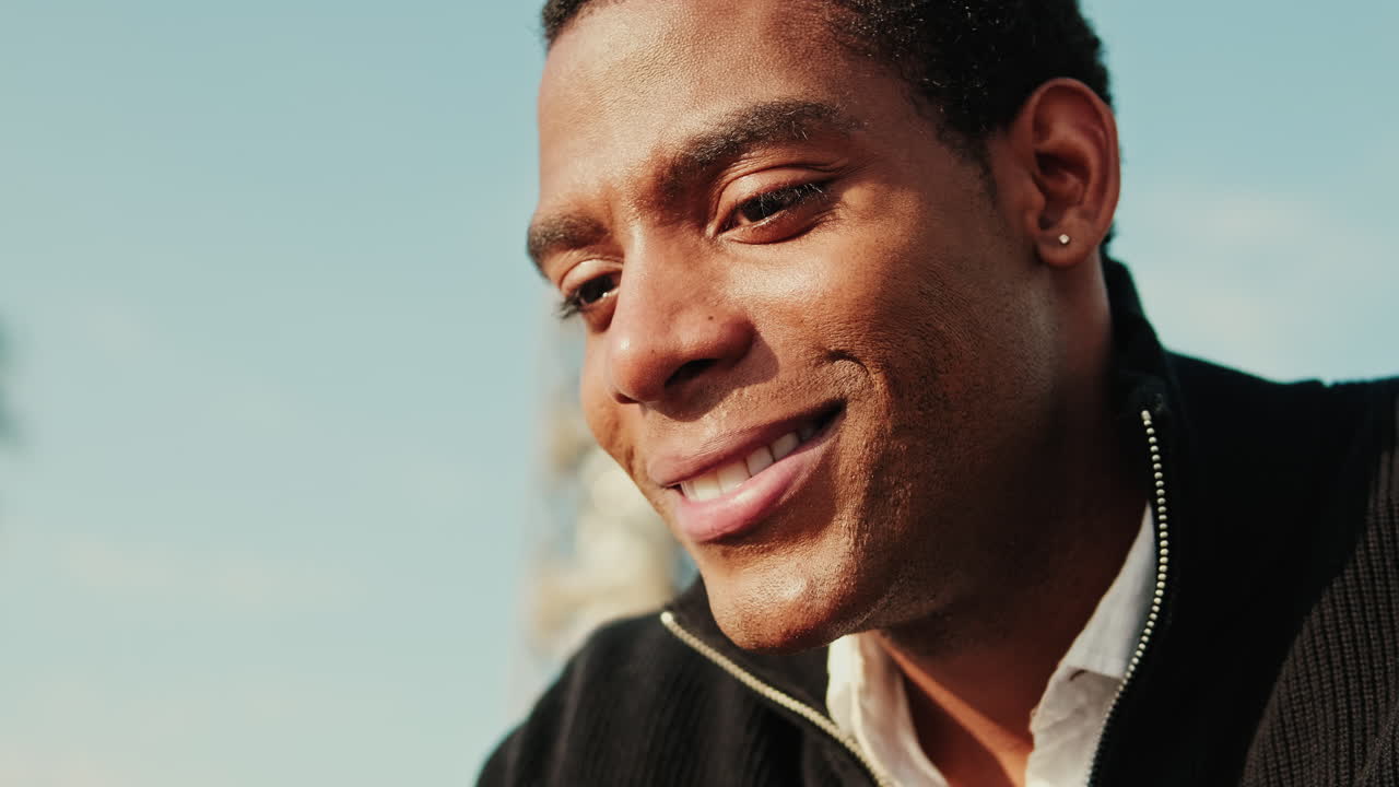Close-up Portrait of a Young Smiling African American Man Outdoors