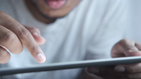 man using a tablet computer