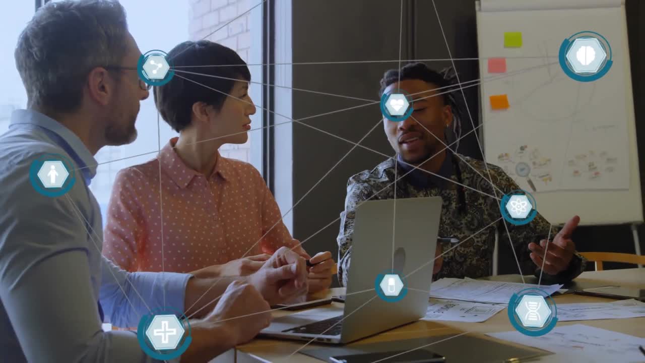 Animation of network of digital icons against diverse colleagues discussing together at office