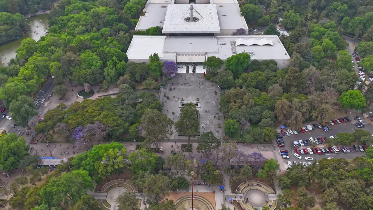 Aerial hyperlapse view of surroundings of the Museum of Anthropology in Chapultepec Park, capturing the urban landscape, CDMX