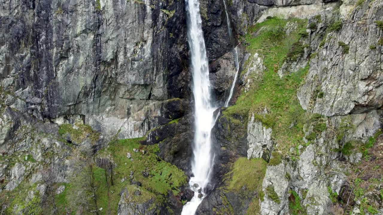 Aerial descent to Kademliya Waterfall's tranquil depths in Bulgaria