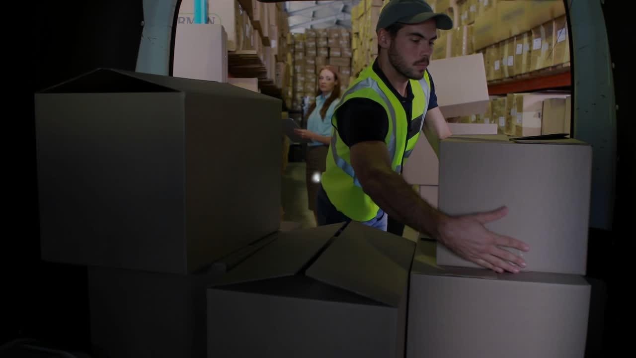 Warehouse worker lifting box and activating node icon expanding network as coworkers passing boxes