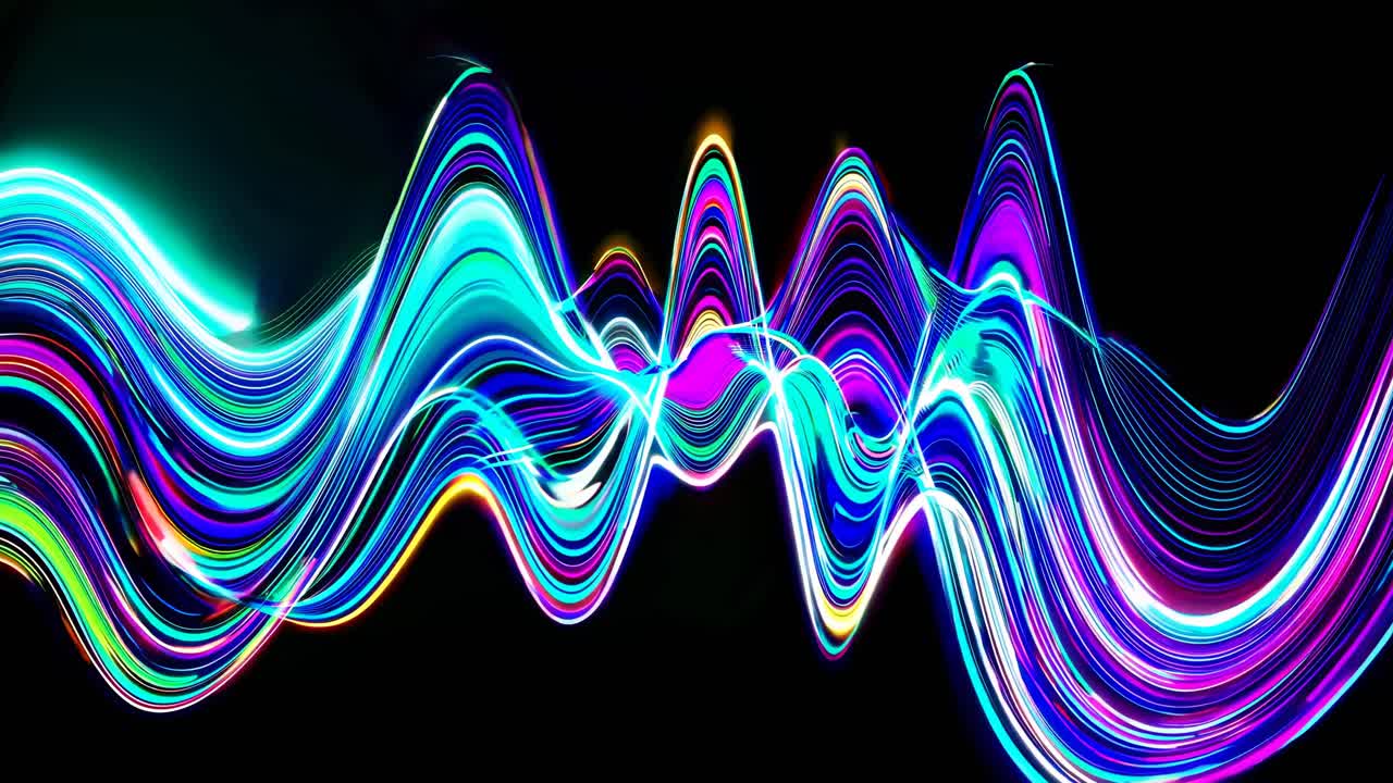 Dynamic, colorful light trails in a wave pattern. Captured from a low angle, this abstract video