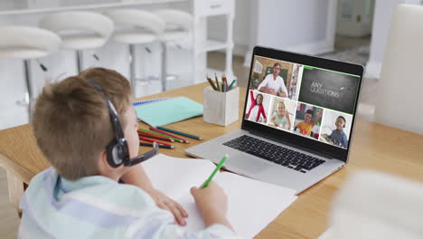composite of boy using laptop for online lesson at home, with diverse teacher and class on screen