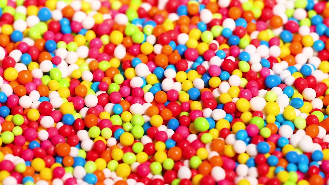 A close-up view of colorful candy sprinkles showcasing a lively mix of hues and textures.