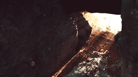 sunbeams through a rocky cave