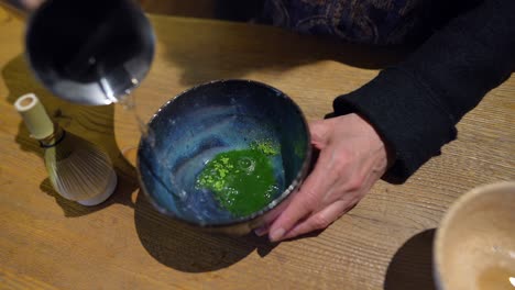 preparing matcha tea