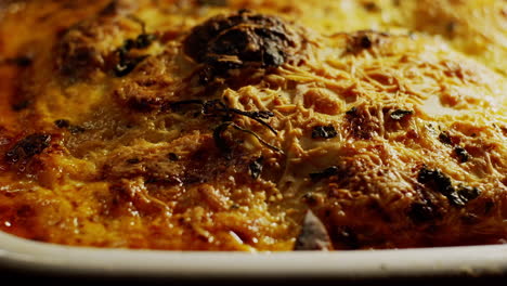 close up shot of a bechamel sauce lasagna with a layer of cheese on its surface