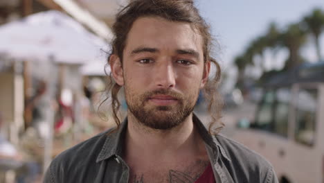 portrait-of-handsome-young-man-opening-eyes-relaxed-on-sunny-beachfront