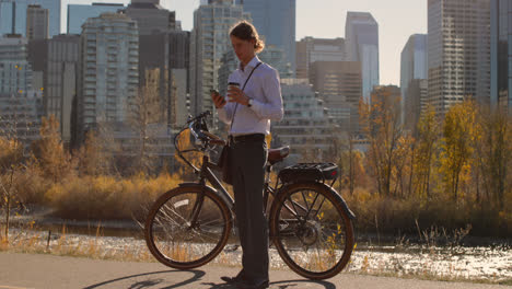 front view of caucasian young man using mobile phone in the city 4k