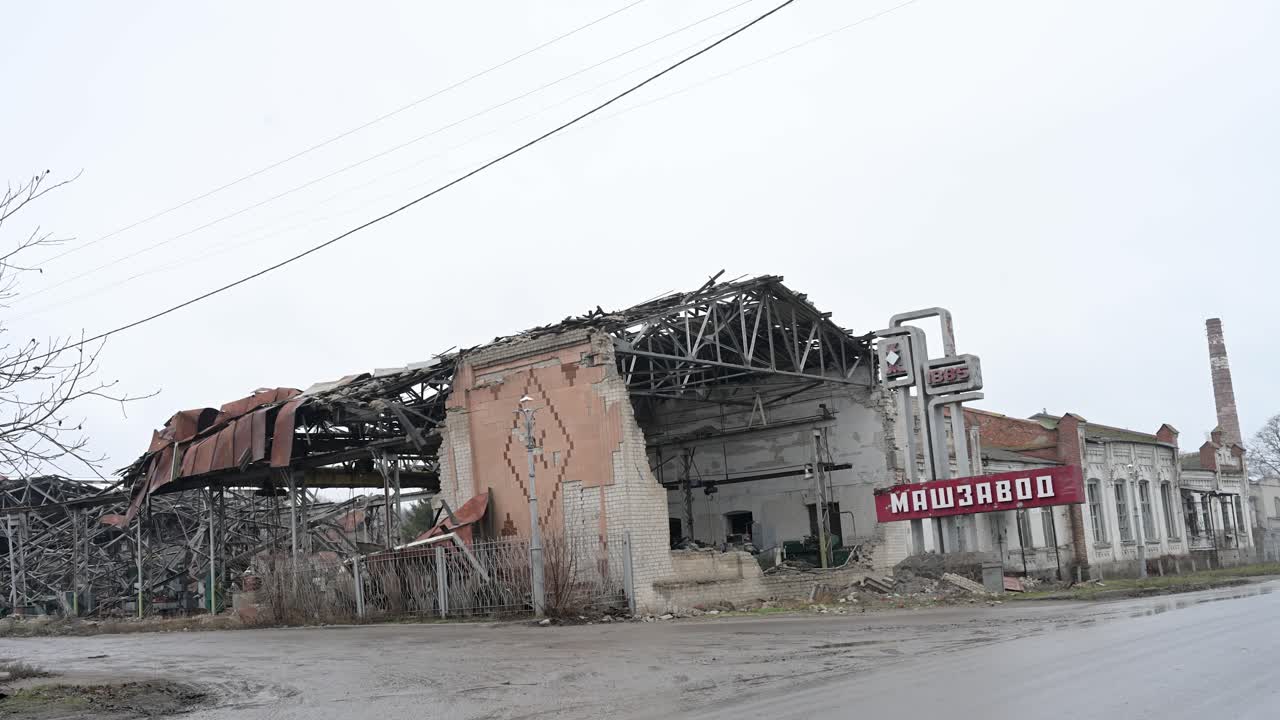 The ruins of the "Mashzavod" machine-building plant in Kupiansk, Ukraine. A collapsed roof and shattered walls show the war's devastating impact on heavy industry on the frontline