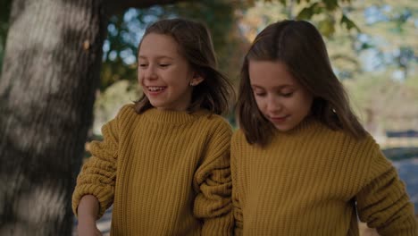 caucasian girls walking together the park .