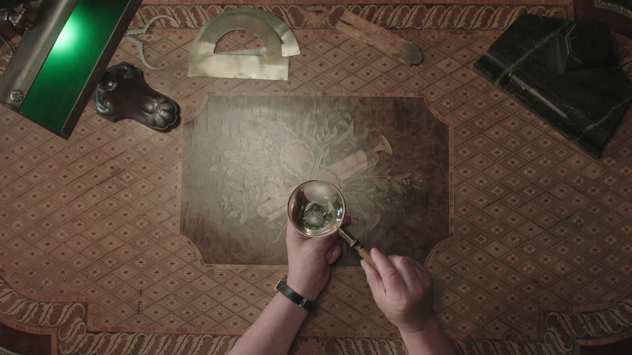 An older man evaluates an antique watch