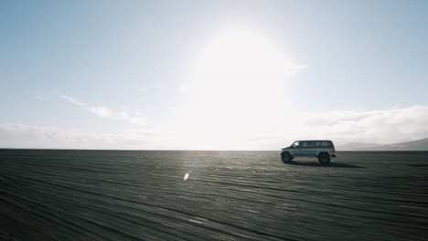 van on black sand