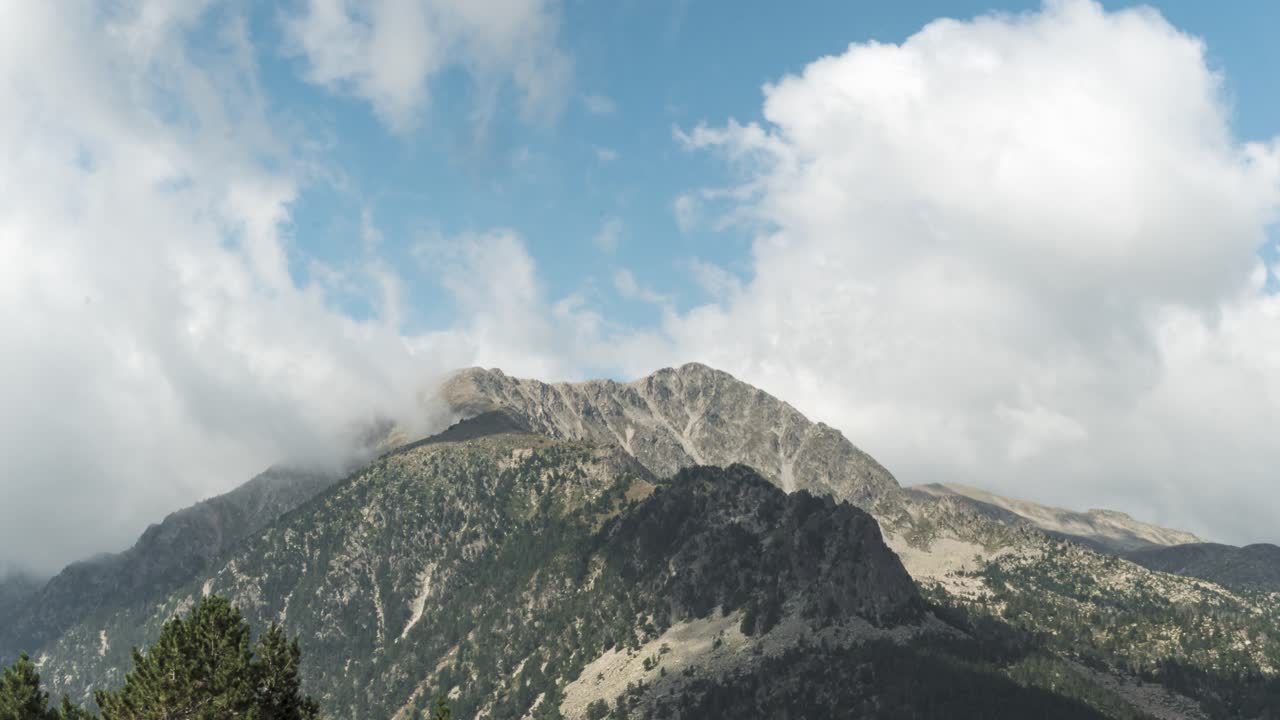 Timelapse Of White Clouds Moving Over The Rocky Peak Of Pyrenees Mountain Near Andorra In Spain
