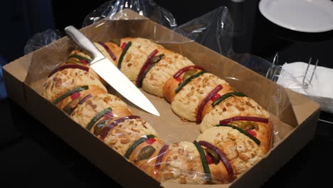 slow motion framing of traditional mexican rosca de reyes bread, special bread with fruit and sugar with the shape of a crown