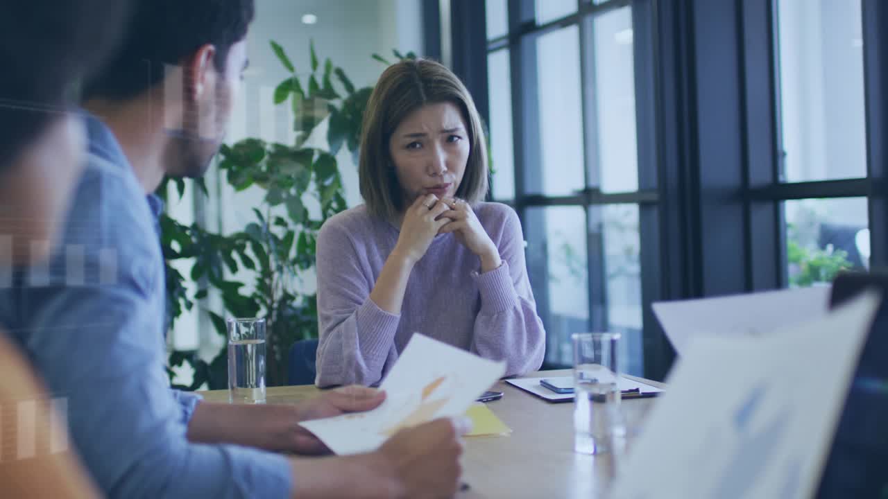 Woman raising hands addressing team in business HUD overlays marking laptop charts to review