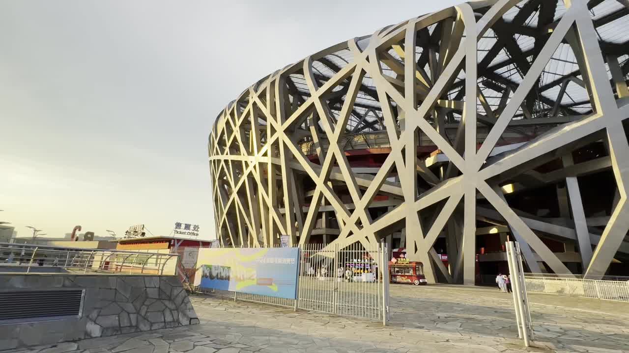 The Beijing Olympic Stadium, Niao Chao, shines brightly during a calm evening