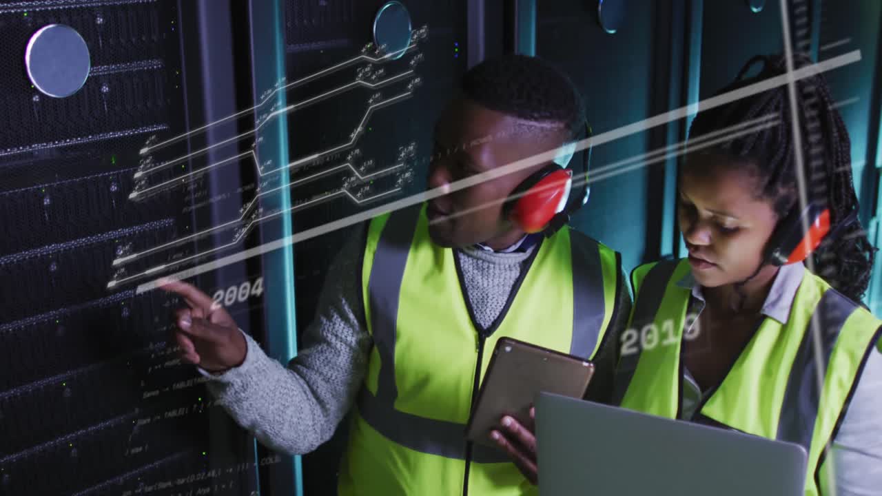 Animation of lines and numbers over african american man and woman working in server room