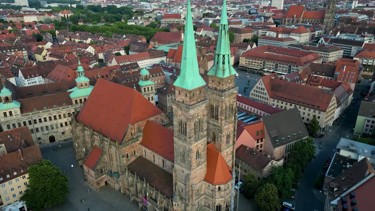 4K Aerial Drone Video of Medieval Sebalduskirche Church with twin spiers in Nurnberg, Germany - Pan Left