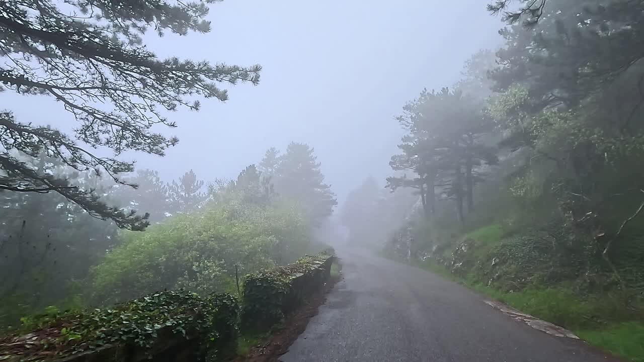 Foggy views of the Winding Road in Kotor Mountains Montenegro at Dusk