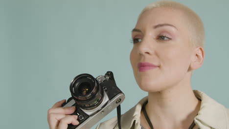 female photographer poses with vintage camera 01