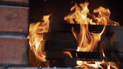 logs burning in fireplace in slow motion