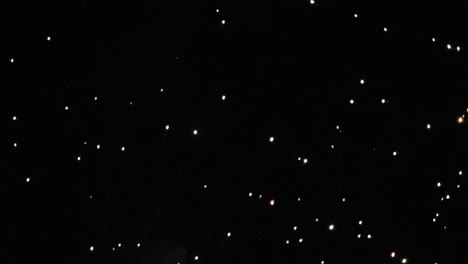 big firework explosion with sparkles floating on black background at night graphic design