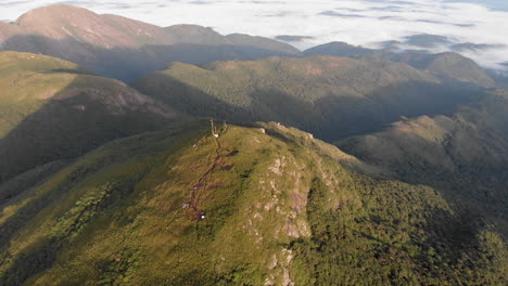 aerial view circling the summit of a rainforest tropical mountain, pico caratuva brazil, south america