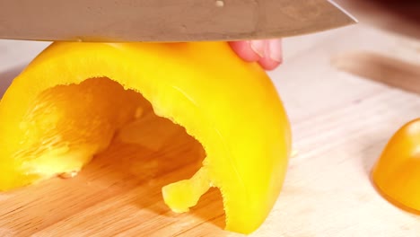 cutting a yellow pepper