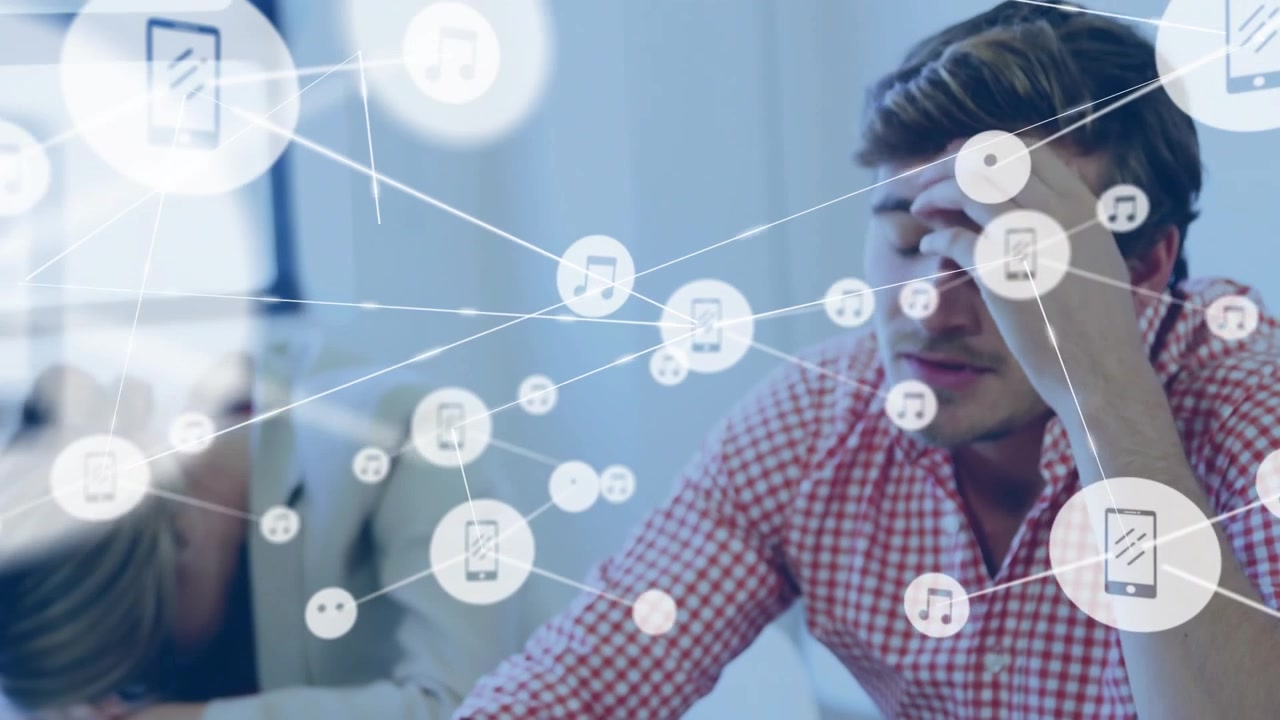 Right man twirling pen over tablet starting nodes covering colleagues and showing business overload