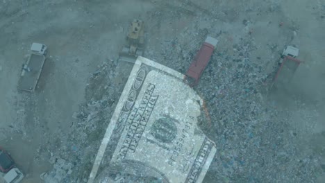 animation of burning american dollar bill over a garbage dump