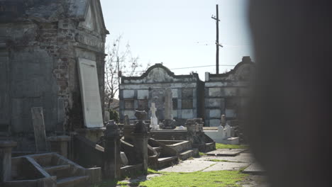 Dilapidated-graves-within-Lafayette-Cemetery-#2-in-New-Orleans,-Louisiana-on-a-sunny,-cold-winter-day