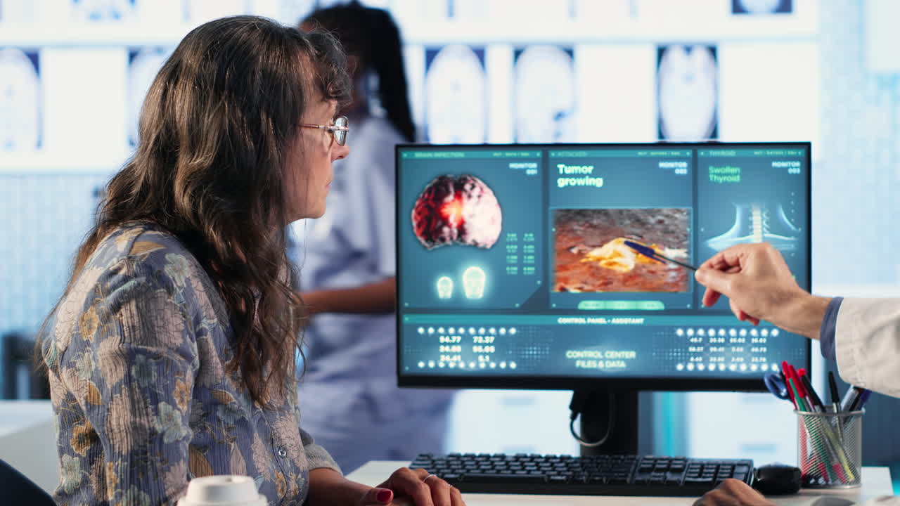 Radiologist discusses an x ray and MRI scan helping a male patient