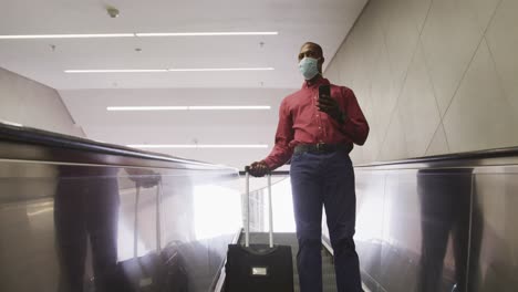 african american man on the go wearing coronavirus covid19 mask