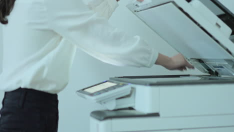 businesswoman using a printer or scanner