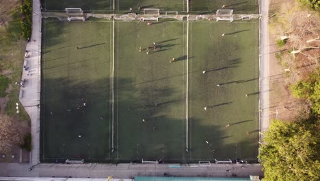 timelapse of people playing on small soccer football training fields