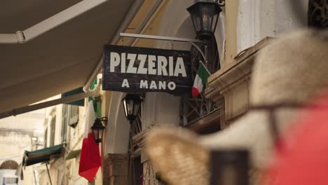 pizza sign, entrance of a pizzeria in corfu