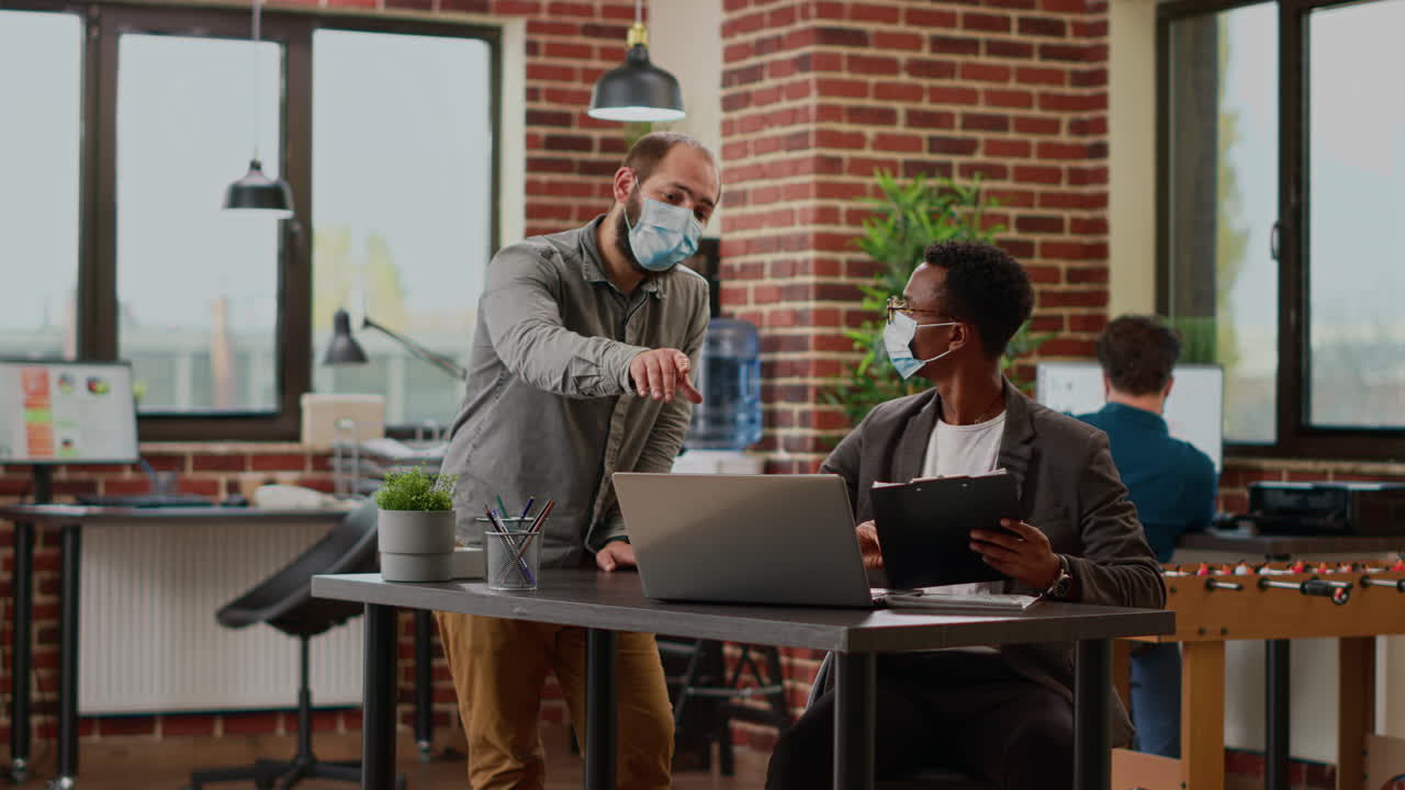 Office workers planning business presentation in startup boardroom