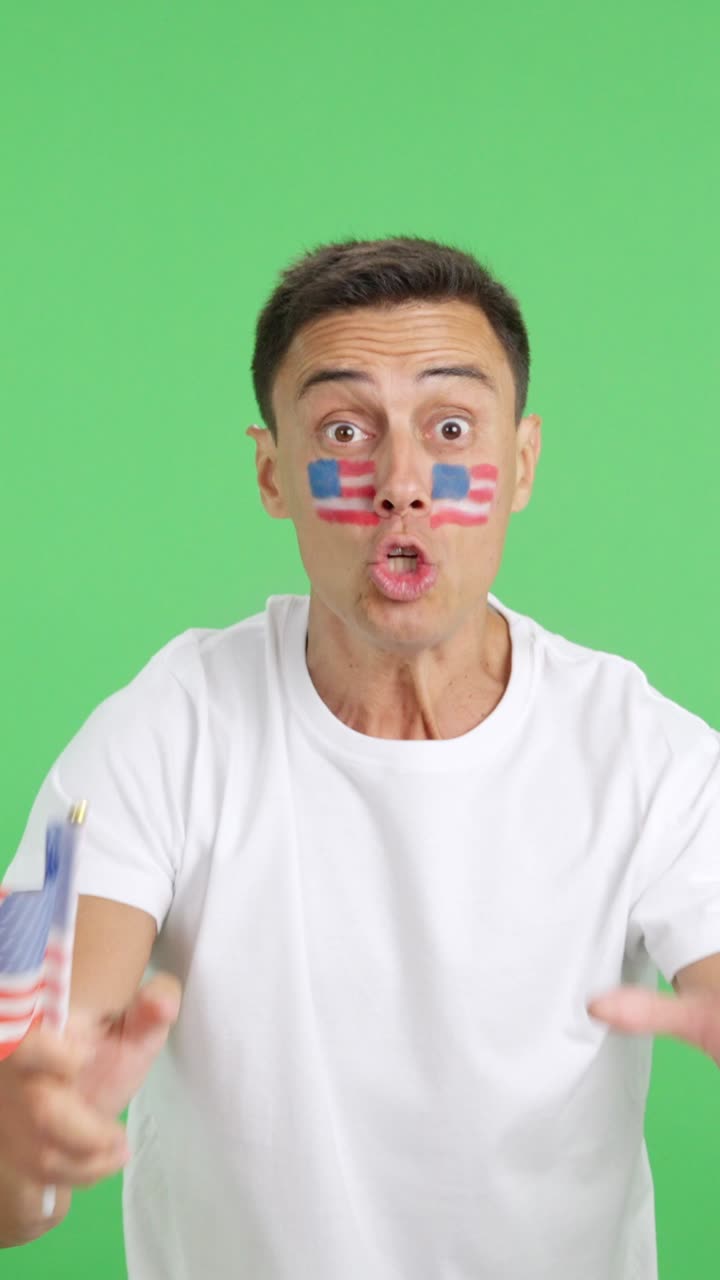 Passionate USA supporter screaming and waving a national flag