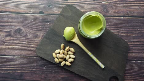 pistachio butter on wooden cutting board