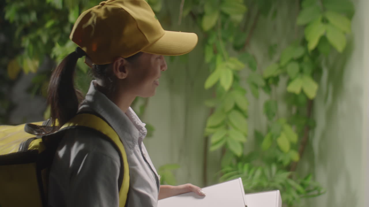 Man Receiving Food Delivery from Female Courier