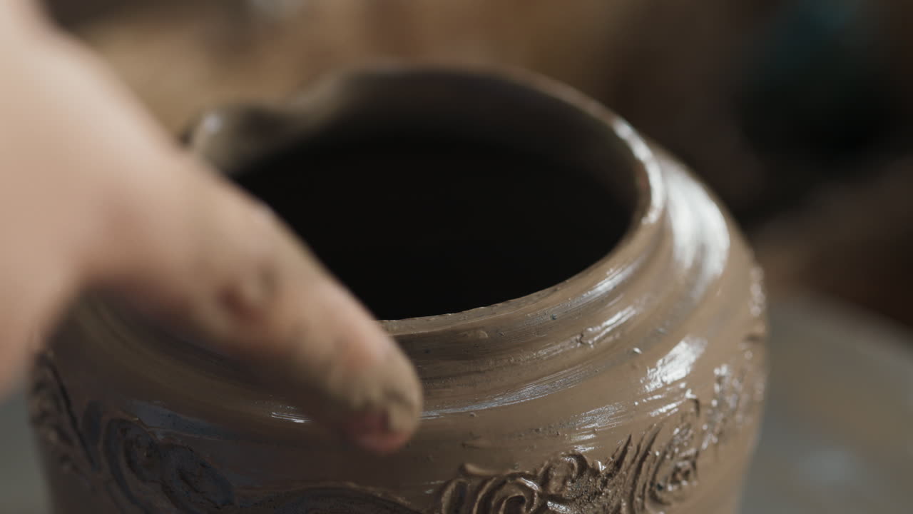 Pottery Artist Working on a Clay Pot