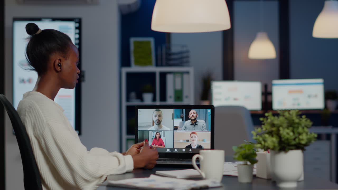 African businesswoman talking during video conference with team