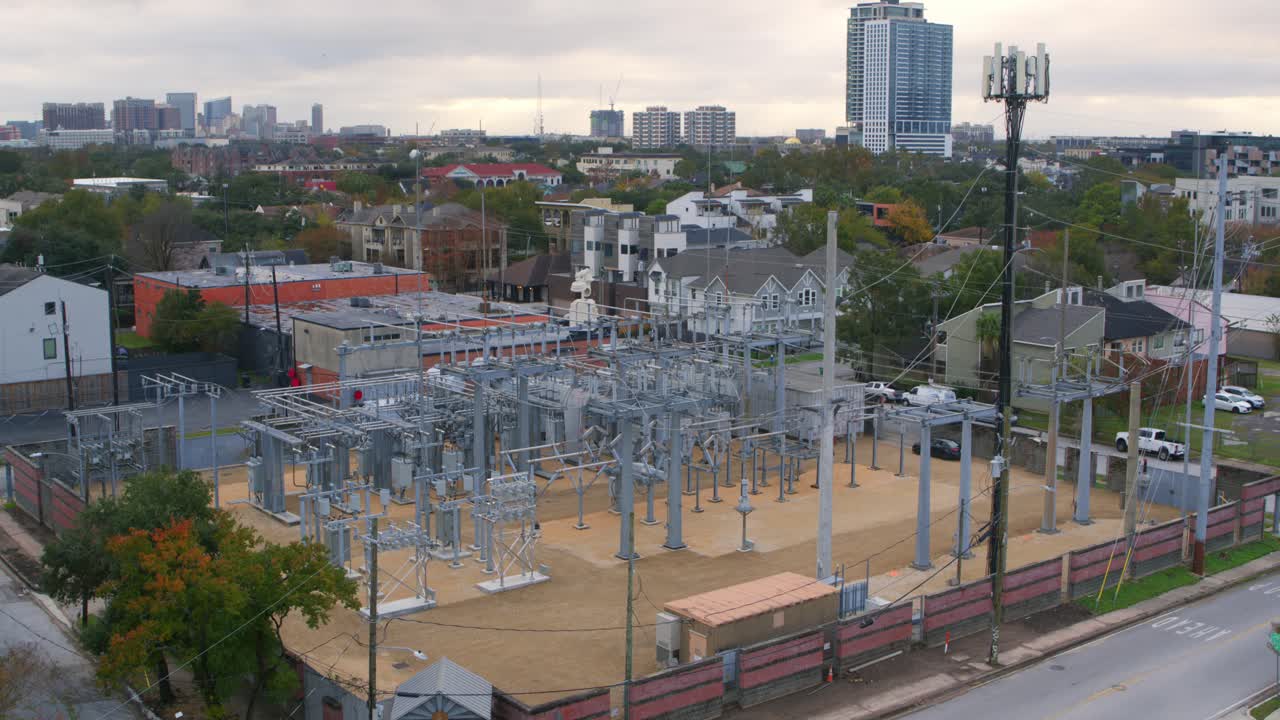 Establishing drone shot of electricity station surrounding by neighborhood in Houston, Texas