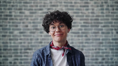 funny woman with curly hair and glasses
