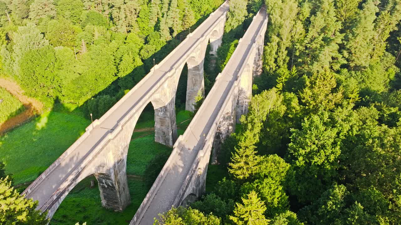 Historic arched bridges of Stanczyki seen from drone in golden morning light