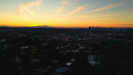 Aerial-View-of-Twilight-Above-Los-Angeles-USA-Cityscape-Skyline,-Sunset-Sky-and-Downtown-in-Horizon