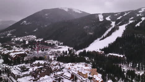 cinematic colorado aerial drone cloudy snowy winter december christmas summit cove keystone ski resort epic local pass entrance rocky mountain breckenridge vail summit county high country circle right